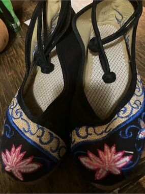 Black Embroidered Wedge Slip-On with Colorful Floral Accent!